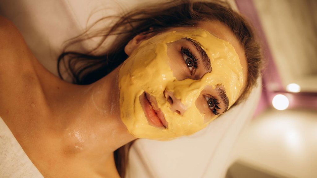 woman puts on honey and yogurt facial mask perfect for your skin