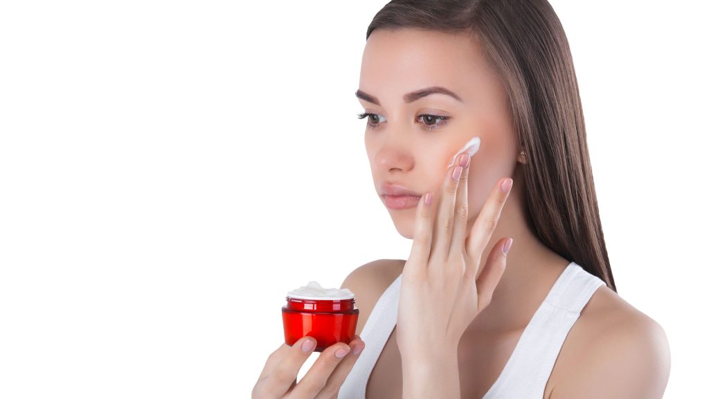 Woman Using Moisturiser to Hydrate Skin