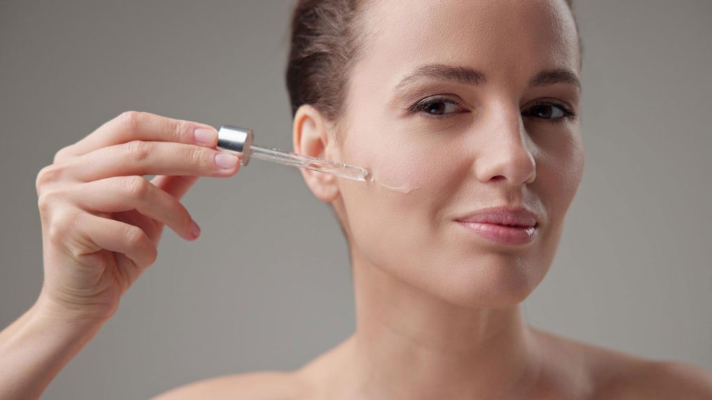 Woman Using Retinol Serum for  Anti Aging Skin Care