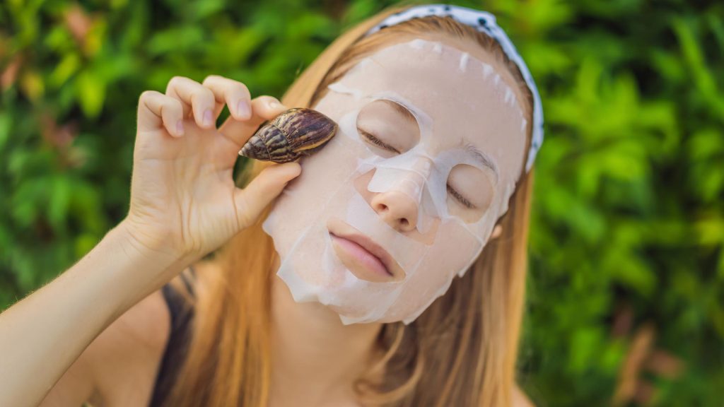 Woman using Snail Slime Face Mask